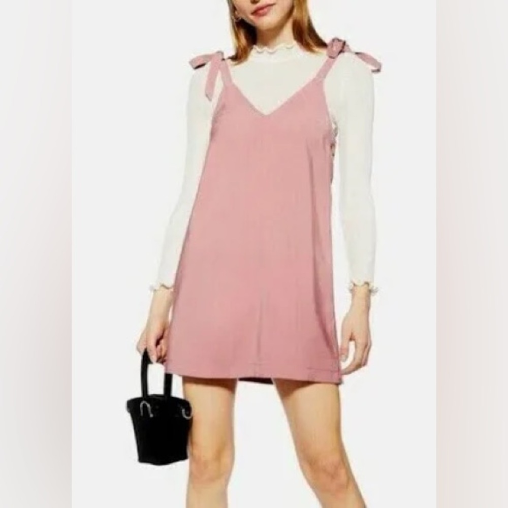 Size 10 new without tags Top Shop dusty rose jumper.  Sleeveless. Wood buttons.